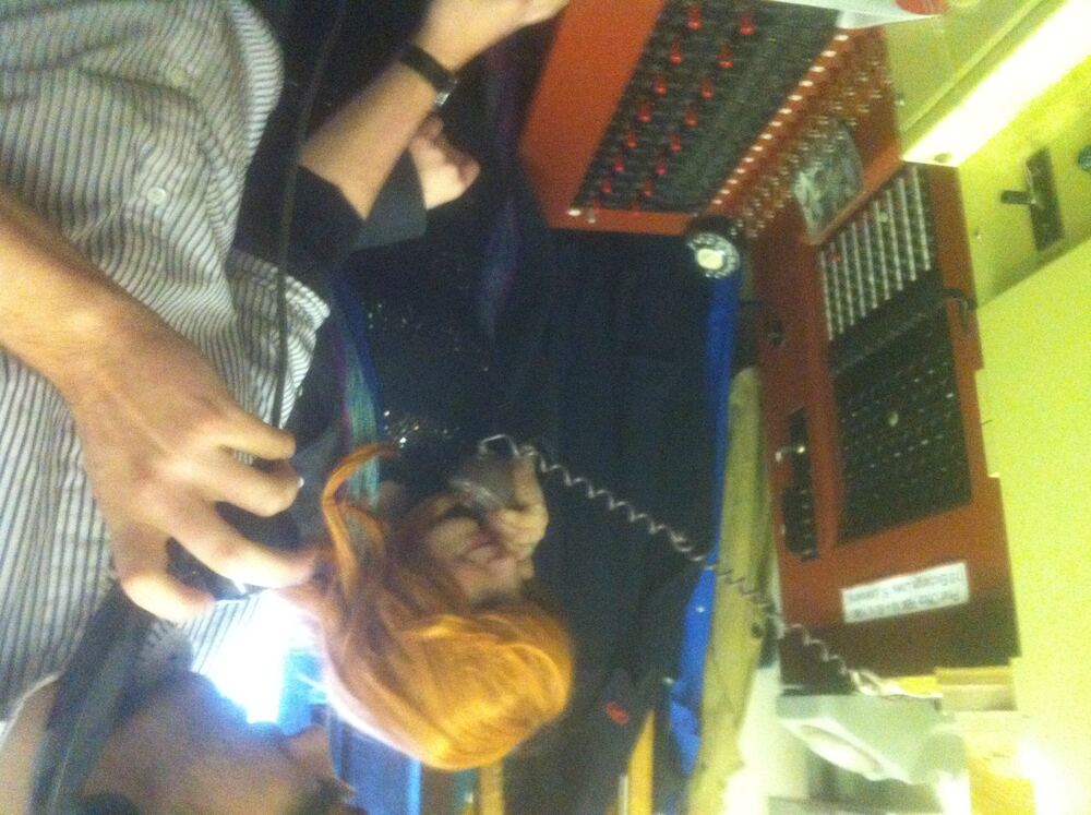 A volunteer demonstrating a manual switchboard
