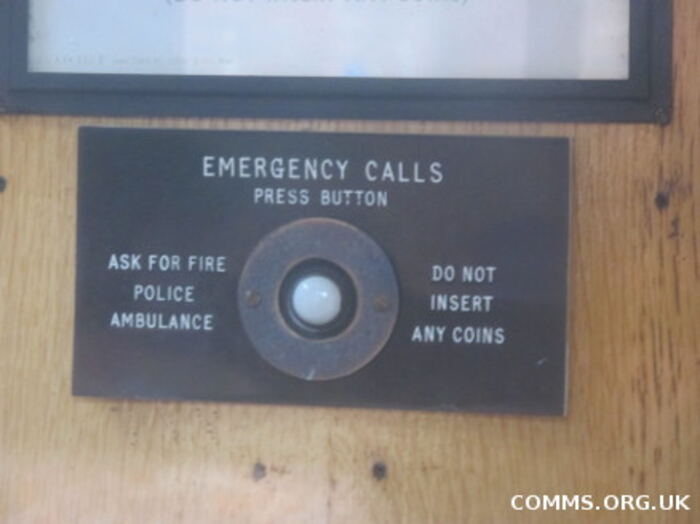 An emergency calls button, press for fire, police or ambulance, no coins needed